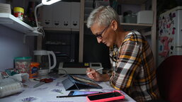 With the help of Caritas Czech Republic, Olesia creates games and books that teach children in Ukraine about their safety