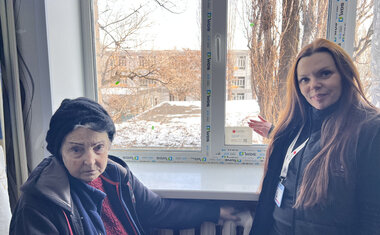 With new window Lyudmila can finally see the sun and air her room