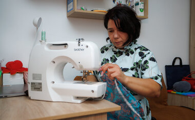 In Berehovo, Natalia draws strength from her children and sewing. In Berehovo, Natalia draws strength from her children and sewing.